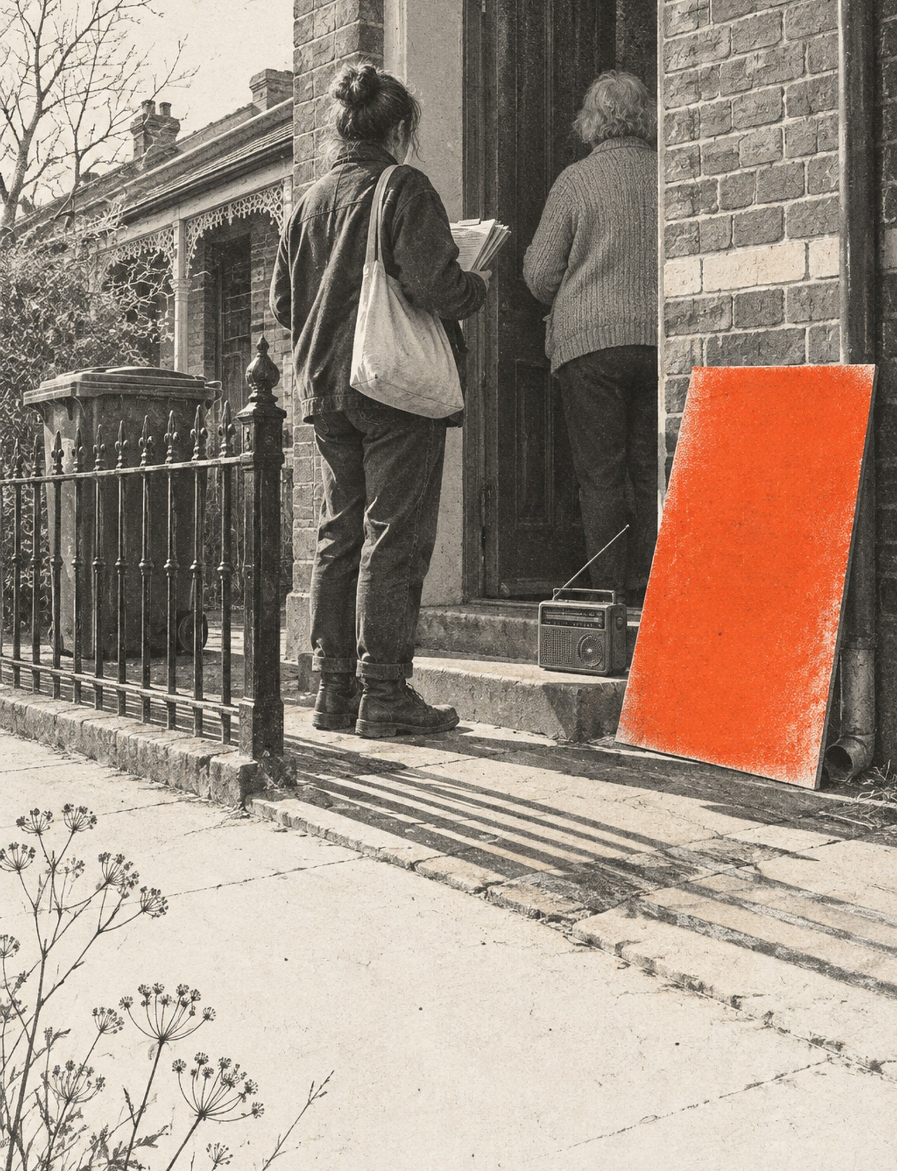 A blank placard leaning beside the open front door of a brick terrace, a radio on the step